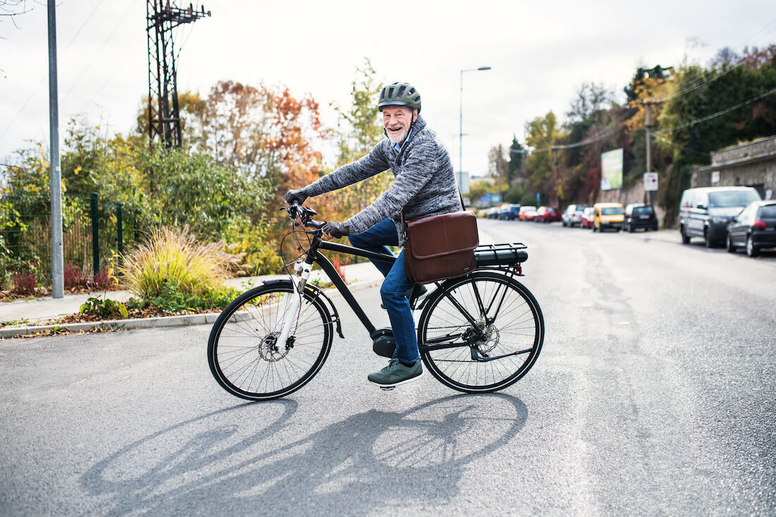 Older man riding bicycle